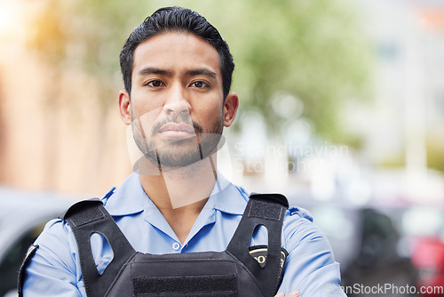 Image of Portrait, serious police man and security guard for protection service, safety and officer patrol in city. Law enforcement, professional supervision and face of asian crime worker in uniform outdoor
