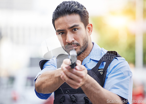 Image of Gun, police man or security guard for protection service, safety and patrol officer in city. Law enforcement, professional supervision and face of asian crime worker in uniform outdoor with weapon