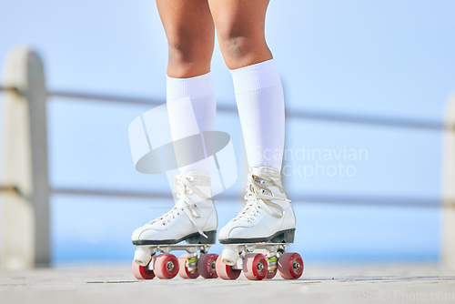 Image of Legs, roller skates and shoes on street for exercise, workout or training outdoor. Skating, feet of person and sports on road to travel, journey and moving for freedom, hobby and fitness practice.