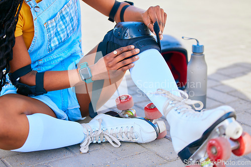 Image of Sports, city and woman with pads for roller skating for fun activity, learning and training outdoors. Summer, safety gear and female person in street ready to skate, exercise and hobby in urban town