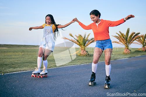 Image of Holding hands, roller skates and friends on street for exercise, workout or training outdoor. Skating, happy people and girls together for sports on road to travel, journey and moving for fitness.
