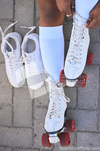 Image of Above, skating and legs of a woman in the street for summer fun, a hobby and getting ready for a derby. Shoes, vintage and the feet of a girl or person playing with outdoor skates in the road