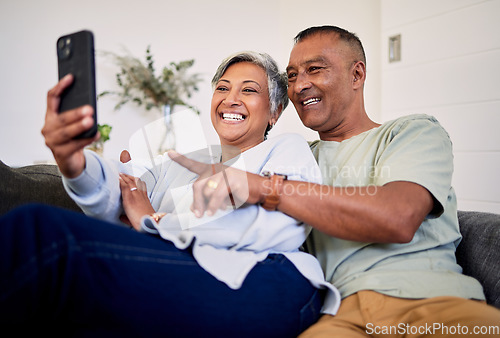 Image of Love, phone or happy senior couple pointing at social media post, retirement news article or relationship blog story. Cellphone, home and elderly man, old woman or people reading online marriage info
