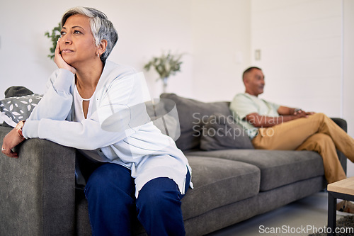 Image of Woman, couple and divorce problem on sofa for drama, frustrated people and conflict at home. Sad lady thinking of argument, bad marriage and fight of breakup, crisis or ignore angry partner in lounge