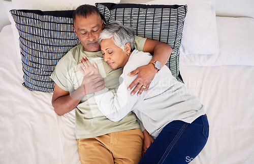 Image of Top view, bed and senior couple hug, sleeping and marriage with peace, relationship and retirement. Romance, old man and elderly woman in a bedroom, asleep and embrace with happiness, home and care