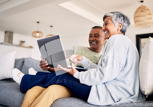 Image of Mature couple, laptop and relax on sofa in living room, download media and choice of watching movie together. Happy man, woman and computer for streaming online video, web subscription and internet