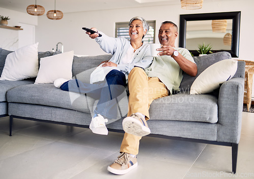 Image of Senior couple, watching tv and remote on sofa in home living room, laughing and smile for funny comedy show. Elderly man, old woman and relax together for video, comic movie and lounge couch in house