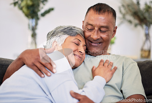 Image of Retirement, love and care with mature couple on sofa to relax in family home for bond. Marriage, smile and senior man or woman in living room for rest or calm with happiness for relationship together