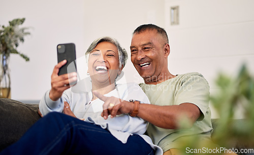 Image of Love, phone and senior couple laughing at funny social media meme, online comic or streaming comedy video. Smartphone application, marriage humour and elderly people laugh at retirement joke at home