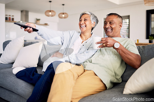 Image of Senior couple, watching tv and relax on sofa in home living room, laughing and together for funny comedy show. Elderly man, old woman and happy for streaming comic movie on lounge couch in house