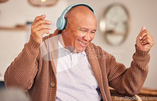 Image of Music, headphones or happy old man listening to radio playlist to relax in house to enjoy retirement. Home, freedom or senior person dancing, smiling or streaming sound, song or audio on break alone