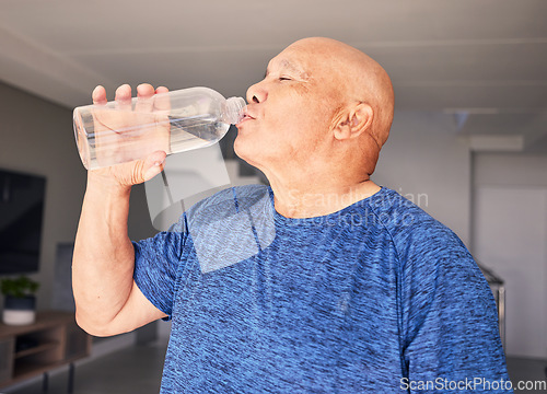 Image of Home, fitness or senior man drinking water for wellness, hydration or exercise recovery in retirement. Training, fatigue or thirsty mature person drinks healthy h2o liquid on a workout break to relax