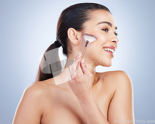 Image of Makeup, profile and woman with a cosmetic brush in studio for natural, glamour and face routine. Beauty, self care and young female model with a cosmetology facial tool isolated by a gray background.