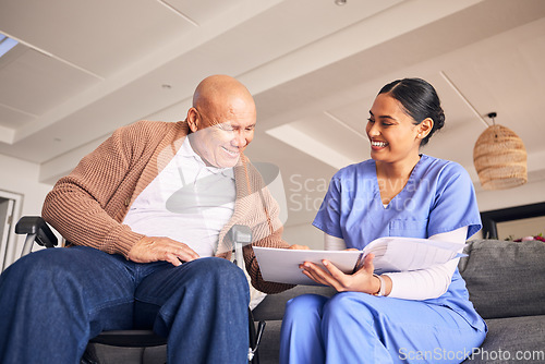 Image of Old man, wheelchair or caregiver reading medical records, history or healthcare documents at nursing home. Smile, documents or happy nurse showing senior patient or elderly person with a disability