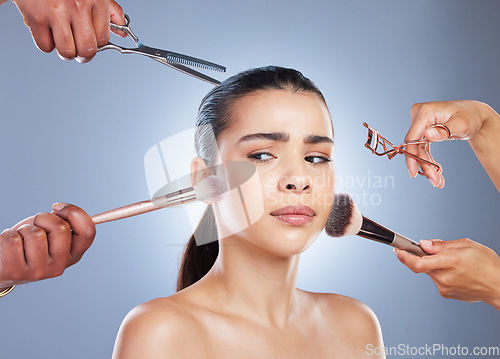 Image of Brush, makeup and face of woman with doubt in studio for wellness, beauty and cosmetics on blue background. Cosmetology, salon and confused female person for application, foundation and products