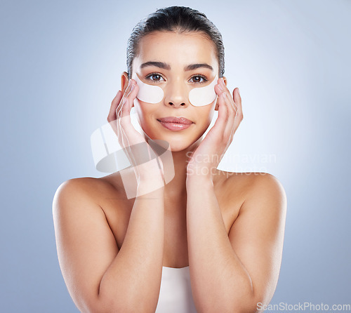 Image of Skincare, eye mask and portrait of woman in studio for wellness, healthy skin and facial. Dermatology aesthetic, salon and face of female person with patches for moisturizer, cosmetics and beauty