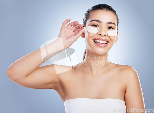 Image of Skincare, eye mask and portrait of happy woman in studio for wellness, healthy skin and facial. Dermatology aesthetic, salon and face of female person with pads for anti aging, cosmetics and beauty