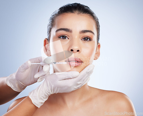 Image of Syringe, woman and plastic surgery with skincare, portrait and cosmetics against a studio background. Female person, girl and model with a needle, face detox or body transformation with aesthetic