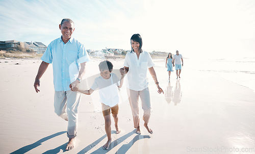 Image of Vacation, beach and grandparents walking child together at the sea or ocean bonding for love, care and happiness. Happy, sun and elderly people with kid on a summer travel holiday for freedom