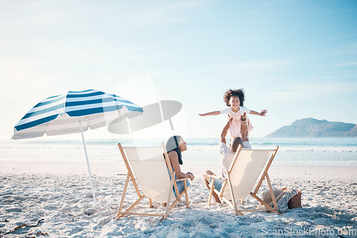 Image of Happy, love and portrait of a family at the beach for playing, bonding and holiday at the ocean. Smile, summer and a child with freedom and playful father with a mother at the sea for a vacation