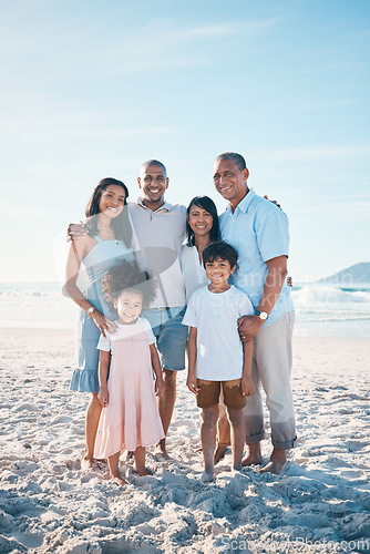 Image of Beach, happy and portrait of a big family on a vacation, adventure or weekend trip for summer. Smile, bonding and children by the ocean with their parents and grandparents on tropical travel holiday.