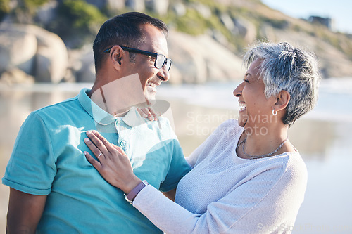 Image of Beach, travel and senior couple laughing for bonding, quality time and relaxing in nature. Love, retirement and happy elderly man and woman by ocean on holiday, vacation and adventure in morning