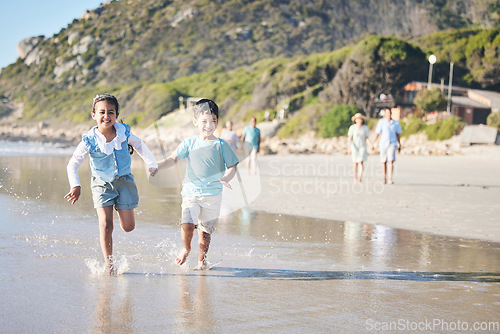 Image of Kids, brother and sister running at beach, excited and holding hands with smile, adventure and vacation. Young children, happy and playful with race, games and freedom by ocean for summer in Hawaii