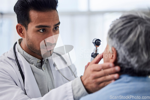 Image of Man, doctor or old woman in eye test assessment in clinic for healthcare, wellness or vision examination. Patient, visual or client testing a mature optician or optometrist in optometry consultation