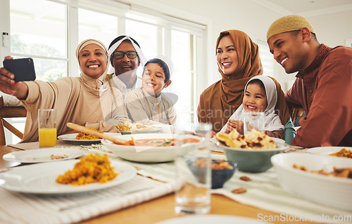 Image of Food, selfie and muslim with big family at table for eid mubarak, Islamic celebration and lunch. Ramadan festival, culture and iftar with people eating at home for fasting, islam and religion holiday