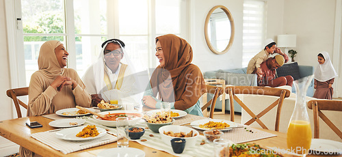 Image of Food, relax and muslim with big family at table for eid mubarak, Islamic celebration and lunch. Ramadan festival, culture and iftar with people eating at home for fasting, islam and religion holiday