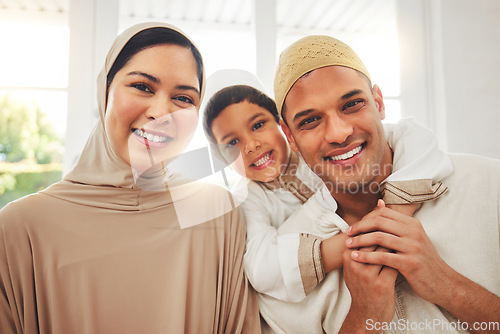 Image of Portrait, hug and happy muslim family of mother, father and child smile, bond and enjoy quality time together. Living room, home happiness and face of Islamic mom, kid and Arabic dad embrace for love