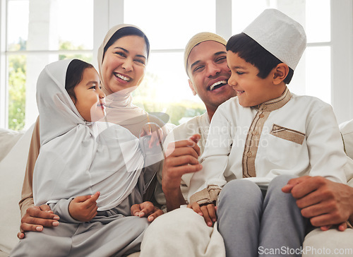 Image of Happy family, Islam and laughing on couch for Eid with mom, dad and kids with home culture in Indonesia. Muslim man, woman in hijab and children smile, funny bonding on sofa together in living room.