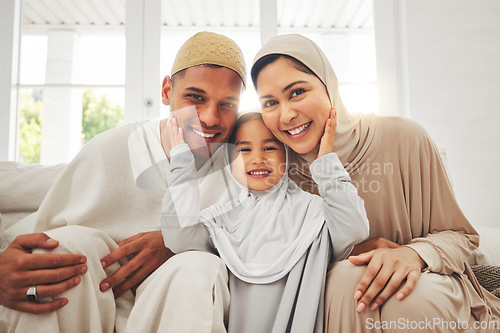 Image of Portrait of parents, child on sofa and Islam, smile for Eid with mom, dad and daughter with home culture in Indonesia. Muslim man, woman in hijab and kid, happy family at Ramadan on sofa together.