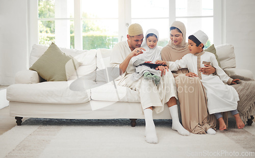 Image of Family home, kids or Muslim parents with tablet for elearning, Islamic info or studying in Allah or God. Child development, dad or Arab mom with children siblings reading online ebook on social media