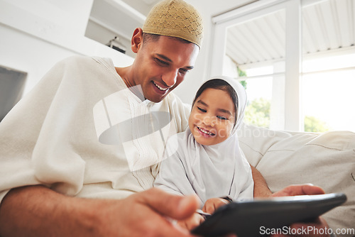 Image of Family, tablet or education with a father and muslim girl on a sofa in the living room of their home together for e learning. Kids, study or child development with a man teaching his student daughter