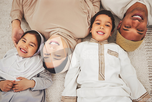 Image of Portrait smile, floor and muslim family of mother, father and children smile, love or enjoy quality time together. Lounge top view, care and happy face of Islamic mom, young kids or dad relax at home