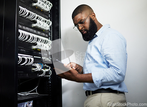 Image of Data center, tablet and serious technician man with cables for internet connection for software programming. Engineer black person with tech for cybersecurity, wire or problem solving in server room