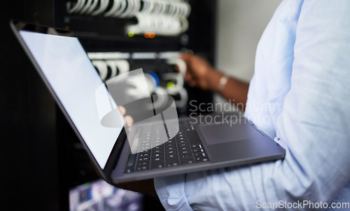 Image of Server room, laptop and IT technician man with internet connection for software programming. Male engineer person with technology for cybersecurity, problem solving or system update in data center