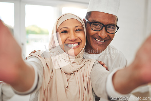 Image of Selfie, Islam and old couple in home with smile, happy culture and love in living room in Indonesia. Marriage, senior man and woman in hijab on sofa in respect, religion and face for social media.