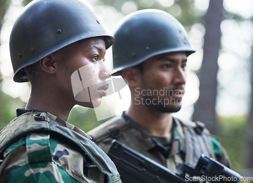 Image of Serious people, army and ready for war, battle or fight on a mission, hero or service in nature. Man and woman soldier or team preparing security, military or conflict on the battlefield in the woods