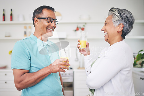 Image of Happiness, senior couple and juice with love in kitchen for bonding in retirement or morning. Marriage, home and elderly man or woman with beverage with conversation together for quality time.