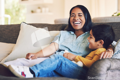 Image of Funny, mother and boy on a couch, love and quality time with happiness, hug and cheerful. Female parent, happy mom and mama with male child, kid on a sofa and family in a home, laughing and relax