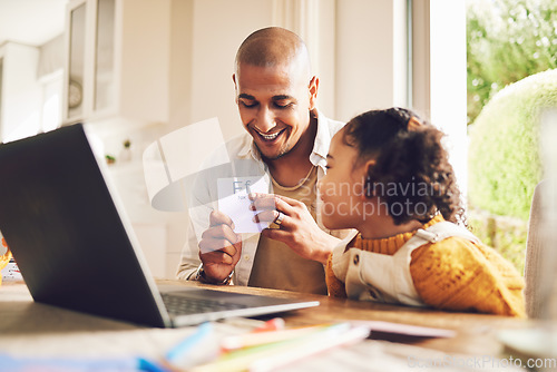 Image of Father, teaching and girl in home for education with cards or laptop for childhood development with happiness. Smile, father and kid is learning with home work or support and childhood development.