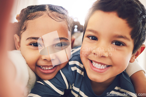 Image of Kids, brother and sister with selfie, portrait and smile in home with hug, care and bonding together. Happy sibling children, photography and profile picture for social media, blog or memory in house