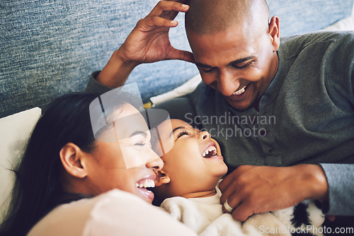 Image of Home, family and parents relax, funny and happiness with quality time, bonding and loving together. Mother, father and female child laughing, humor and calm on a weekend break, care and kid with joy