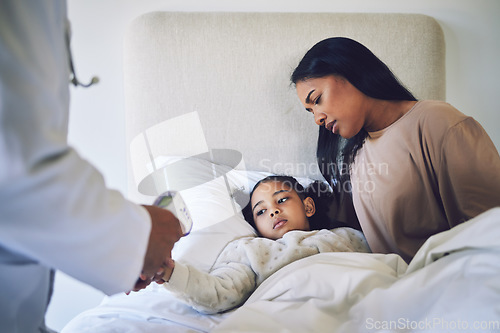 Image of Doctor, mother and daughter with fever, thermometer and check with worry, health and temperature in bed. Medic, inspection or exam for flu, sick child and mom in bedroom for wellness in family house