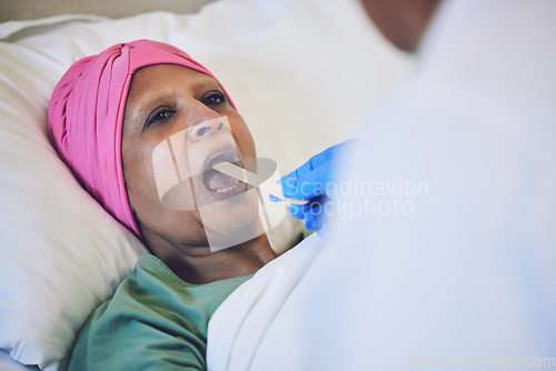 Image of Throat stick, cancer and patient in bed with cold, flu or respiratory illness at her home. Sick, medical and woman at a doctor consultation or checkup for infection or disease in clinic or hospital.