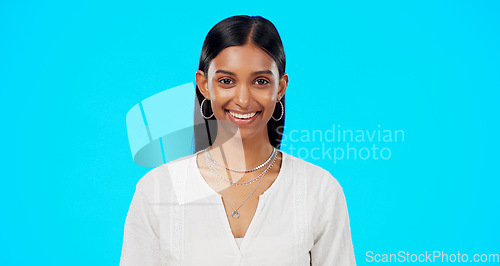 Image of Laughing, studio and Indian woman face with blue background ready for work. Business employee, smile and happy portrait of a young female worker and professional isolated with happiness and joy