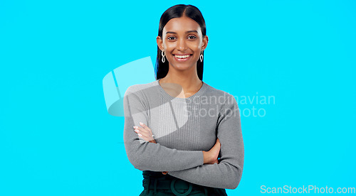 Image of Smile, confident and portrait of businesswoman arms crossed excited, proud and isolated in a studio blue background. Leader, professional and female with a positive mindset relax, calm and happy
