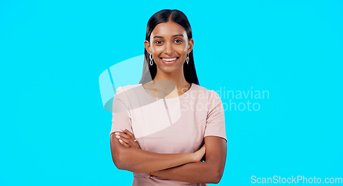 Image of Smile, confident and portrait of woman arms crossed excited, proud and isolated in a studio blue background. Leader, confidence and female with a positive mindset relax, calm and happy person